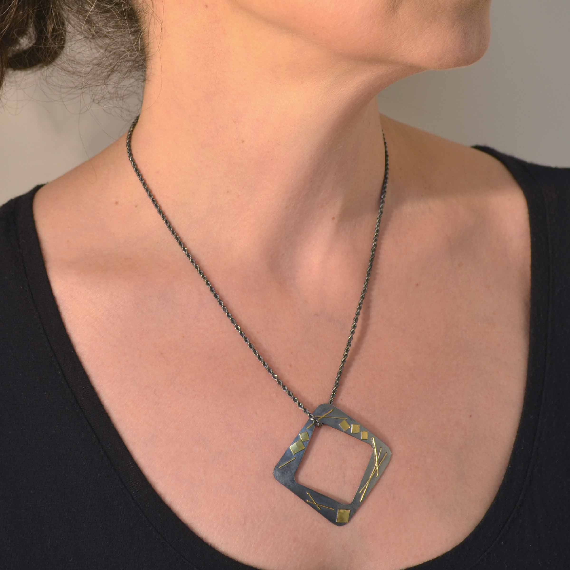 Suzanne Schwartz Wearing Open Square Necklace