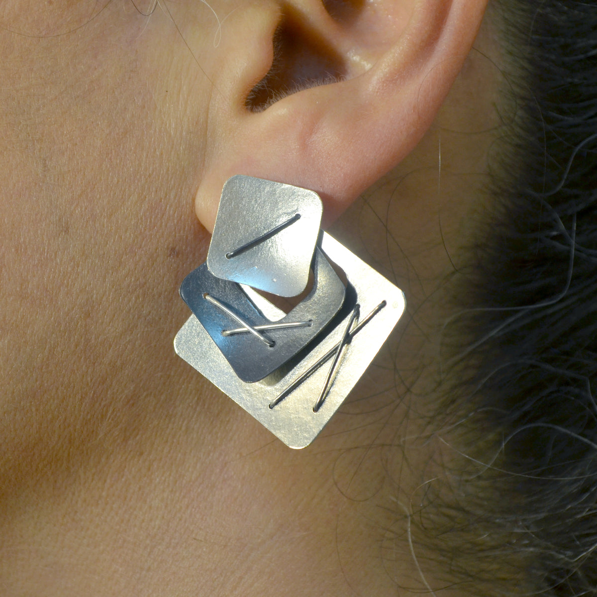 Suzanne Schwartz Wearing Three Piece Layered Earrings with Large Top